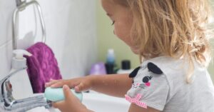 girl washing hands