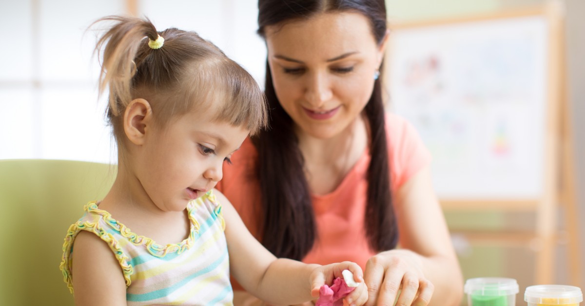 girl playing with adult
