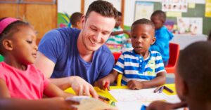 man at table with children