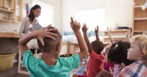 woman reading to class