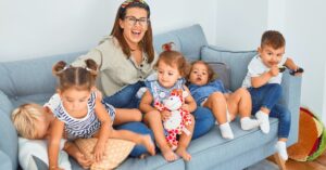 woman with 5 kids on a couch