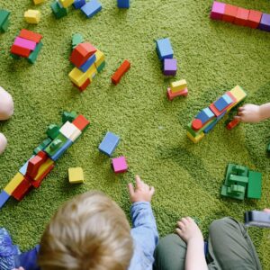 Pre-K students playing with toys.