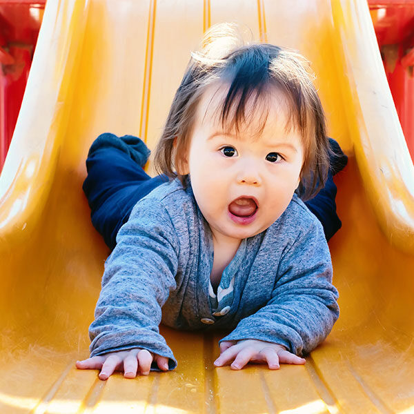 child on slide